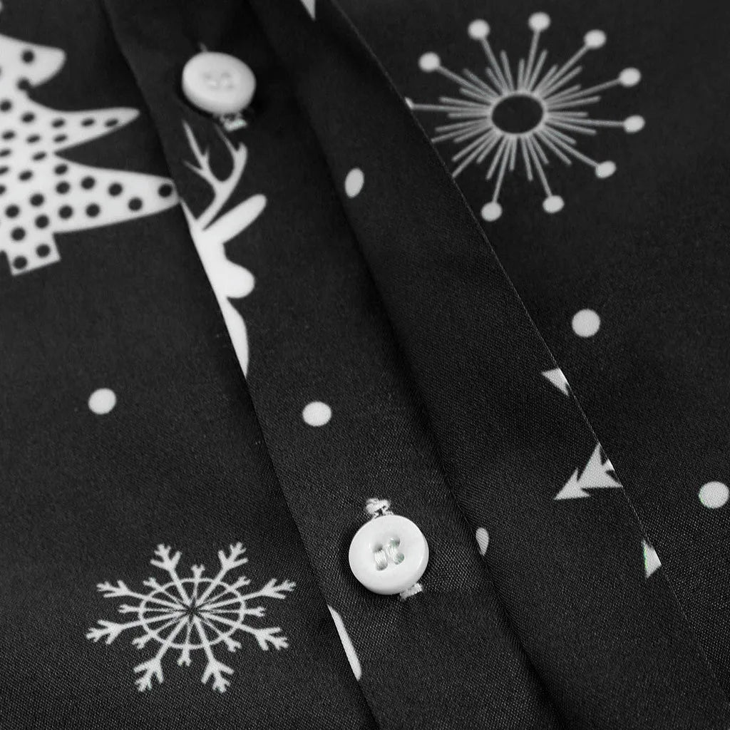 Black fabric with white Christmas tree, reindeer, and snowflake patterns.