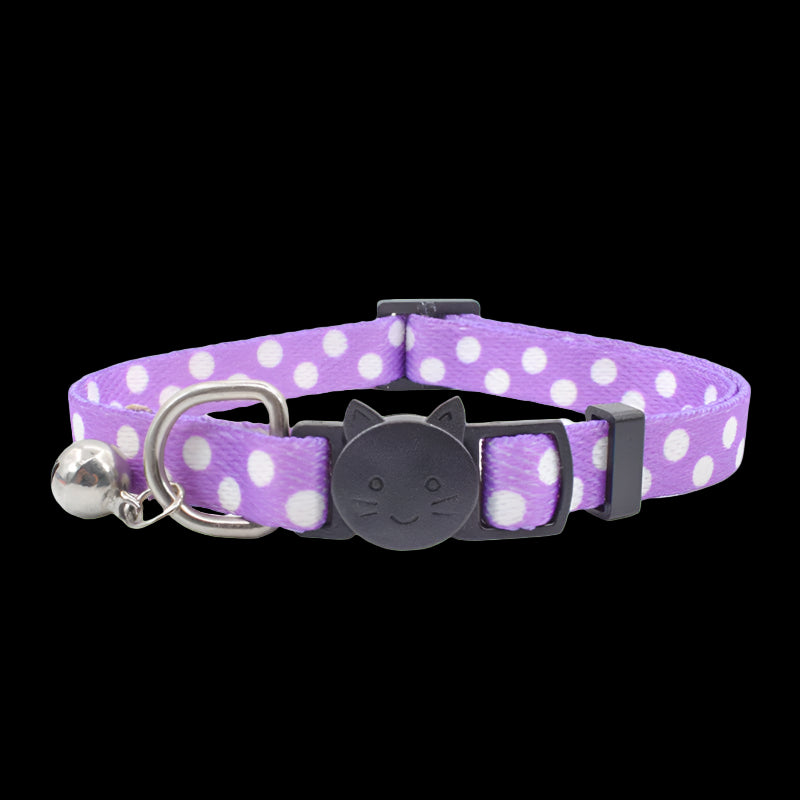 Purple polka dot cat collar with a bell and black cat-shaped buckle on a white background