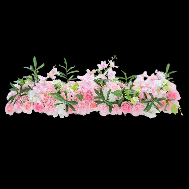 Floral arrangement with pink and white flowers on a white background