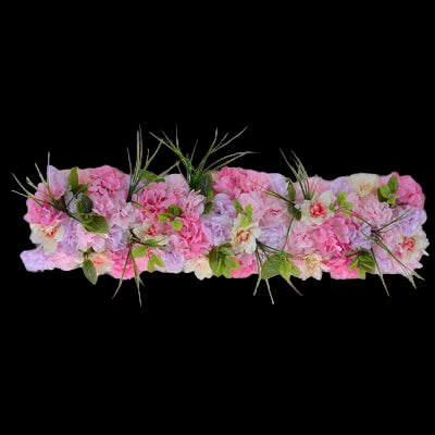 Floral arrangement with pink and green flowers on a gray background