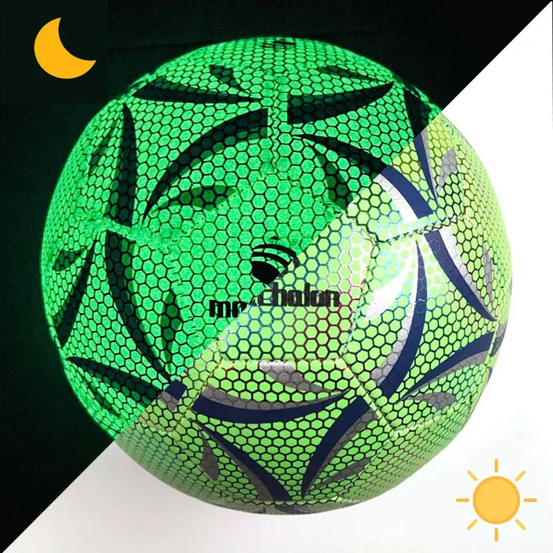 Green soccer ball with black patterns on a black and white background
