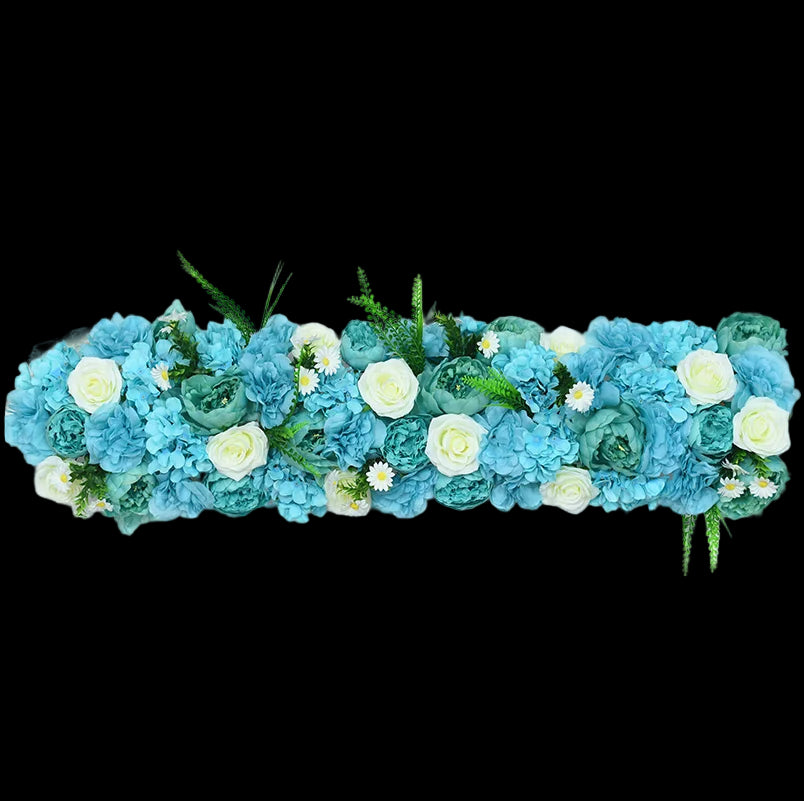 Floral arrangement with blue and white flowers on a light gray background