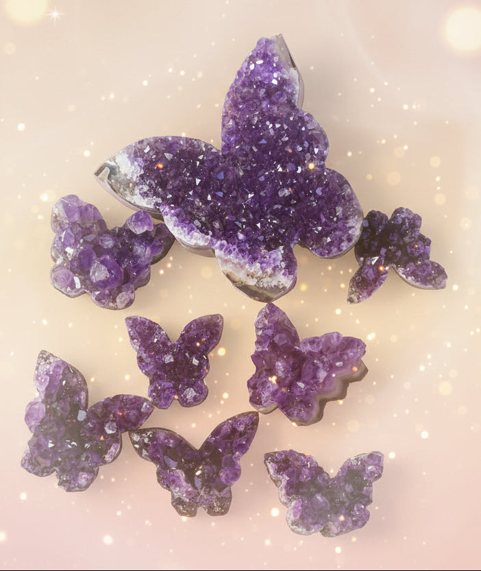 Purple butterfly-shaped crystal decorations on a newspaper background