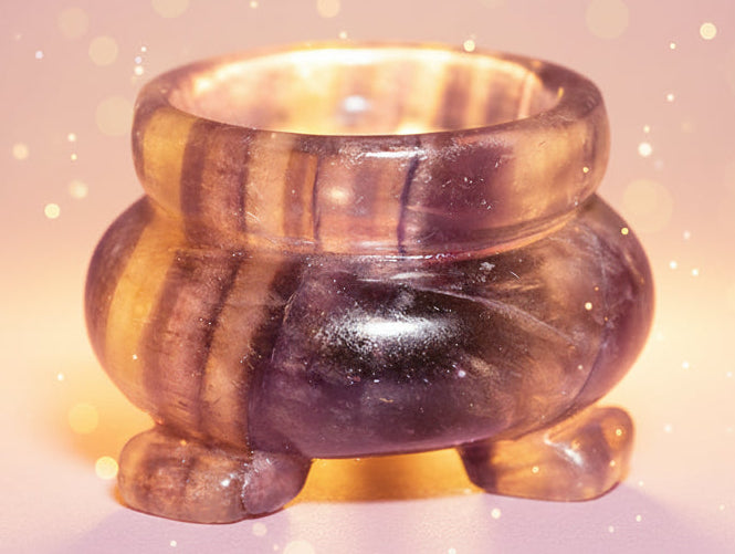 Multicolored striped stone ring on a white background