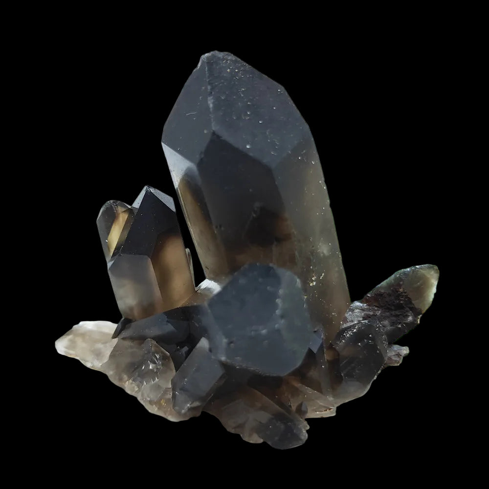 Smoky crystal cluster on a grid background with greenery