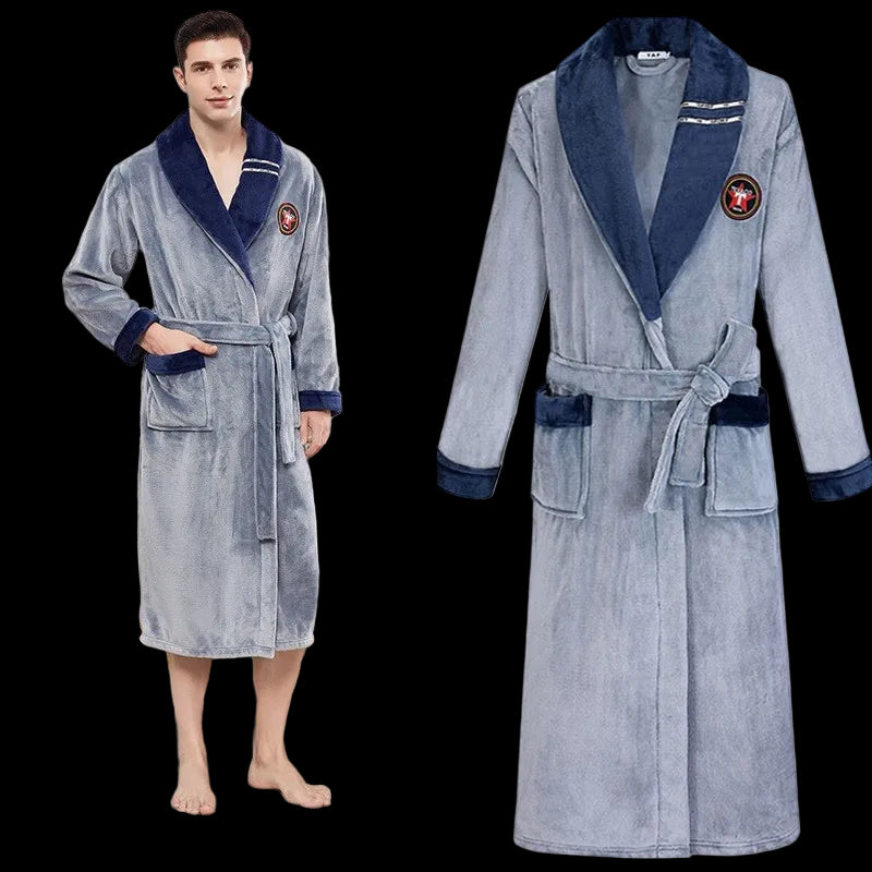 Gray bathrobe with navy trim worn by a person in a room setting.