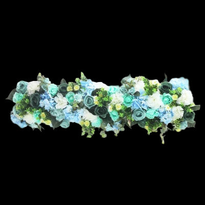 Decorative floral arch with green, blue, and white flowers on a white background