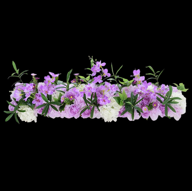 Decorative floral arrangement with purple and white flowers on a light gray background