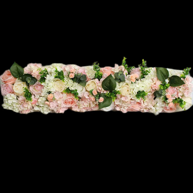 Floral arrangement with pink, white, and green flowers on a white background