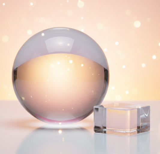 Clear sphere and rectangular block on a white background