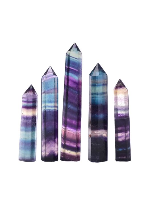 Set of five multicolored crystal towers on a white background