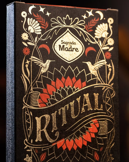Decorative box with 'Sagrada Madre Ritual' text and intricate designs on a dark background