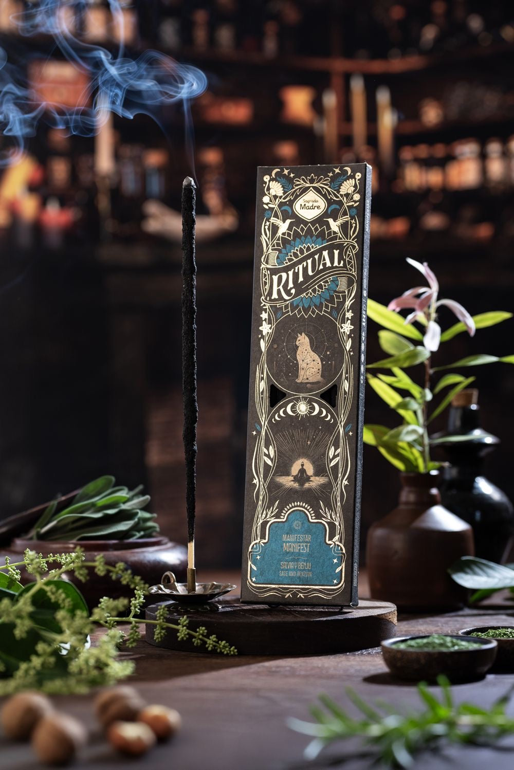 Decorative box with 'Ritual' branding on a table with plants and a blurred background