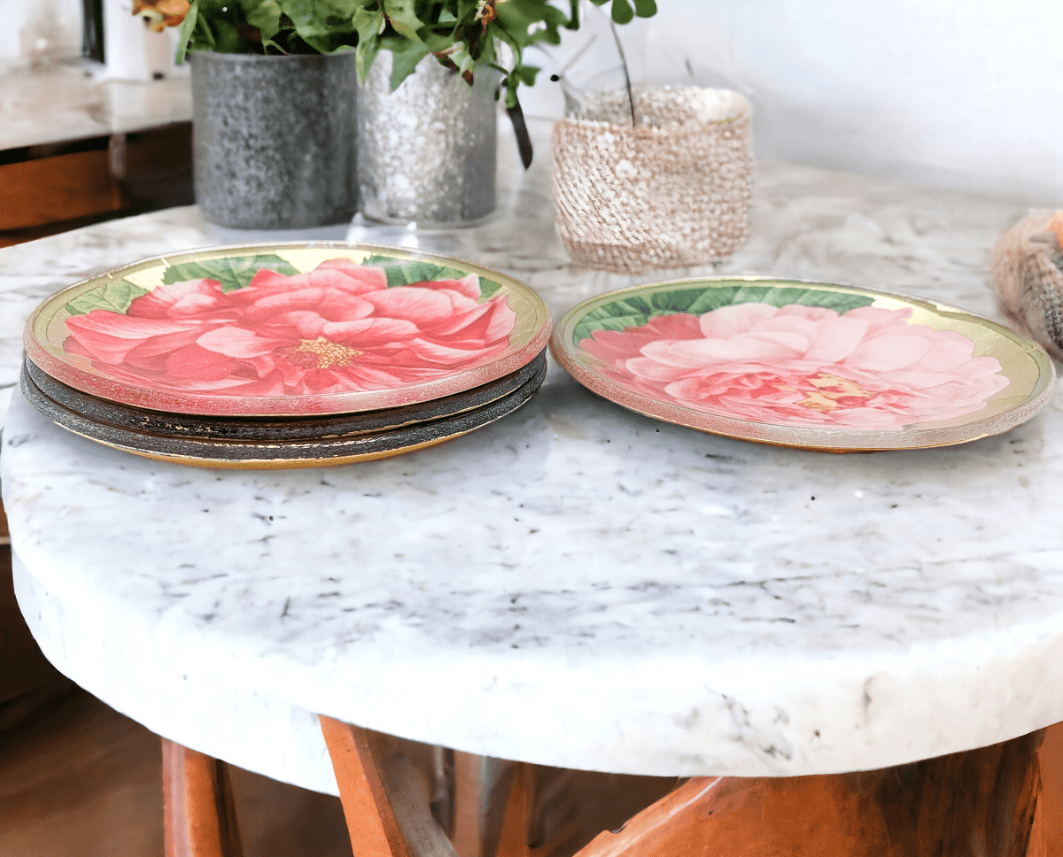 Decorative plates with floral design on a marble table
