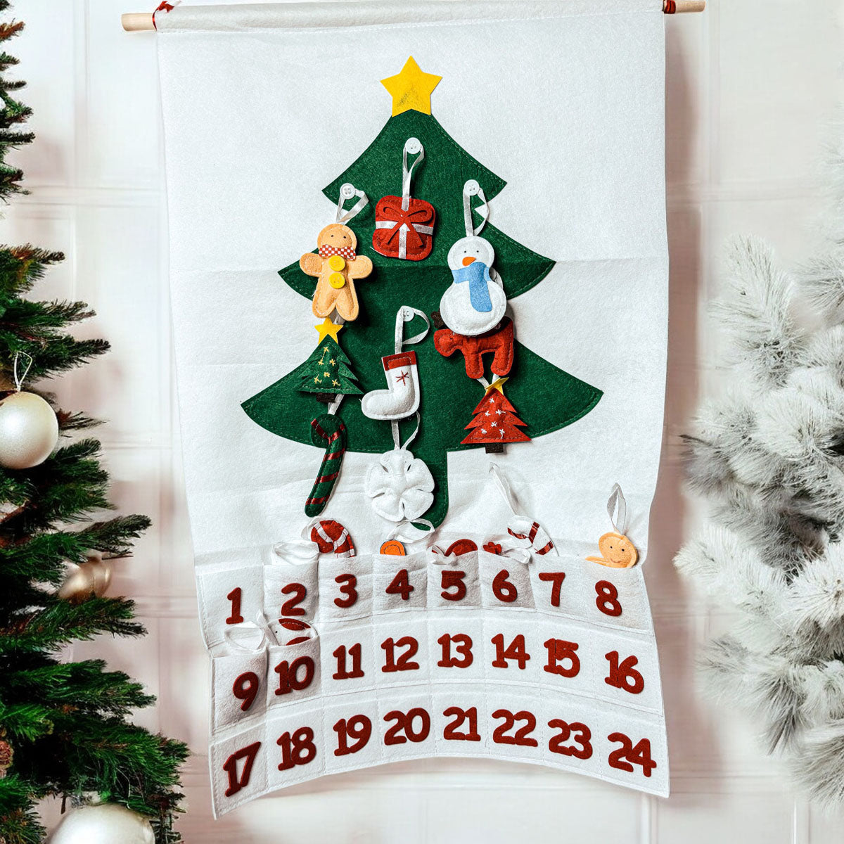 Felt Christmas tree advent calendar with decorative elements on a white background
