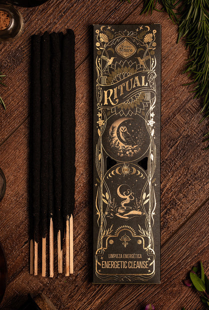Incense sticks with decorative packaging on a wooden surface