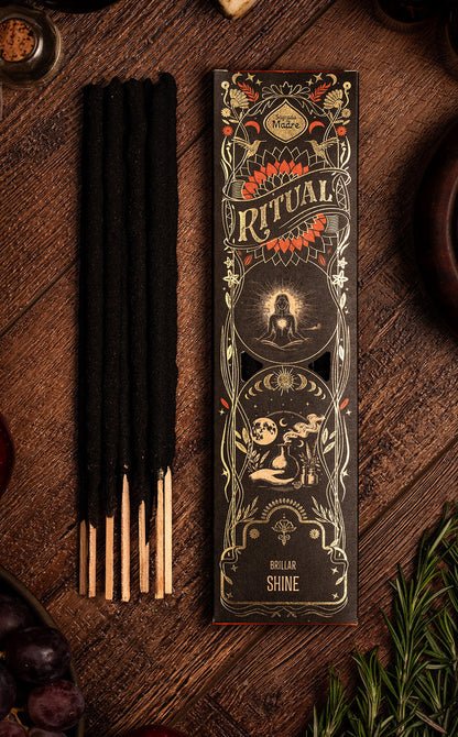 Ritual incense packaging with incense sticks on a wooden surface