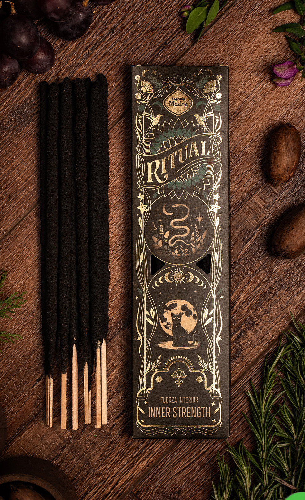 Incense sticks with decorative packaging on a wooden surface