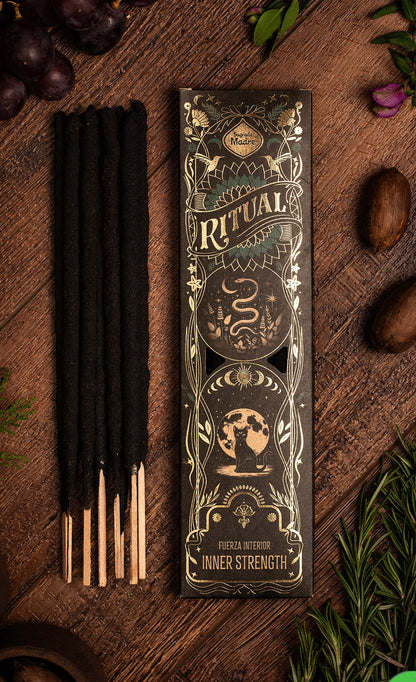 Incense sticks with decorative packaging on a wooden surface