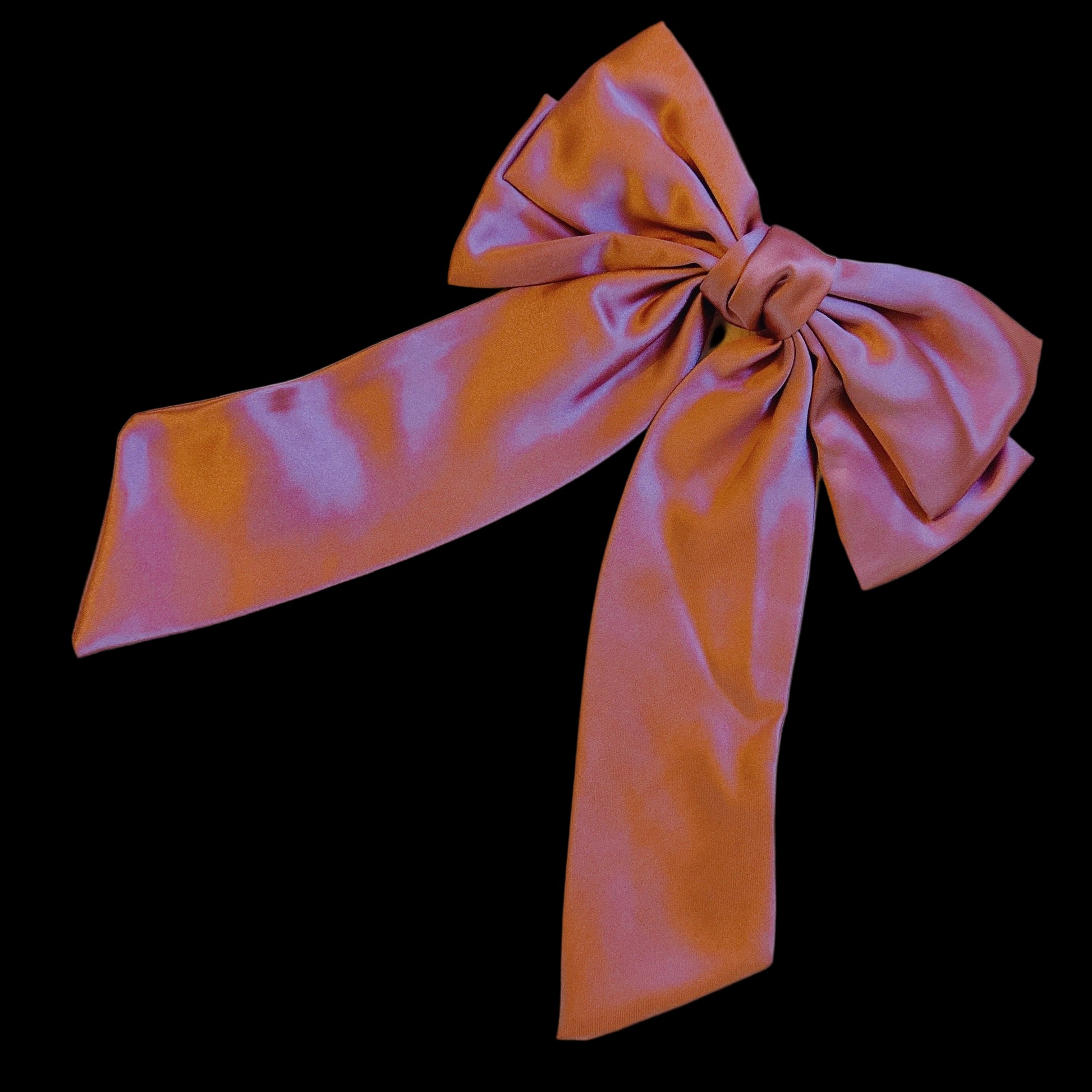 Pink and orange bow on a light gray background