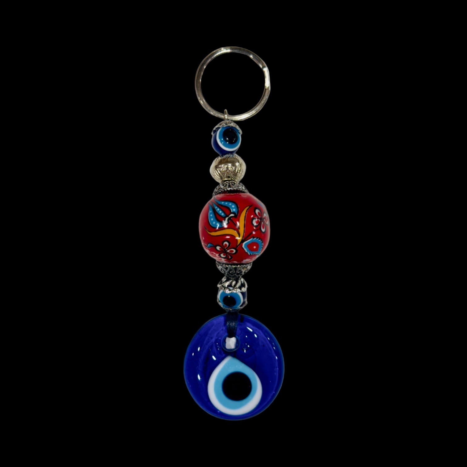 Keychain with colorful bead and blue evil eye charm on a white background
