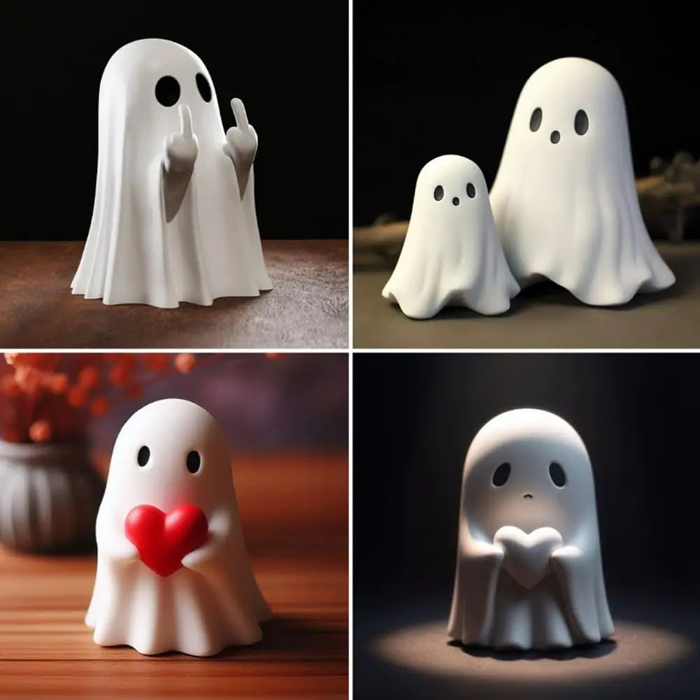 Set of four ghost-shaped night lights with different expressions and poses on a dark background.