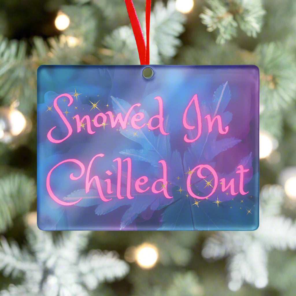 Decorative sign with 'Snowed In Chilled Out' text on a blue and purple gradient background.