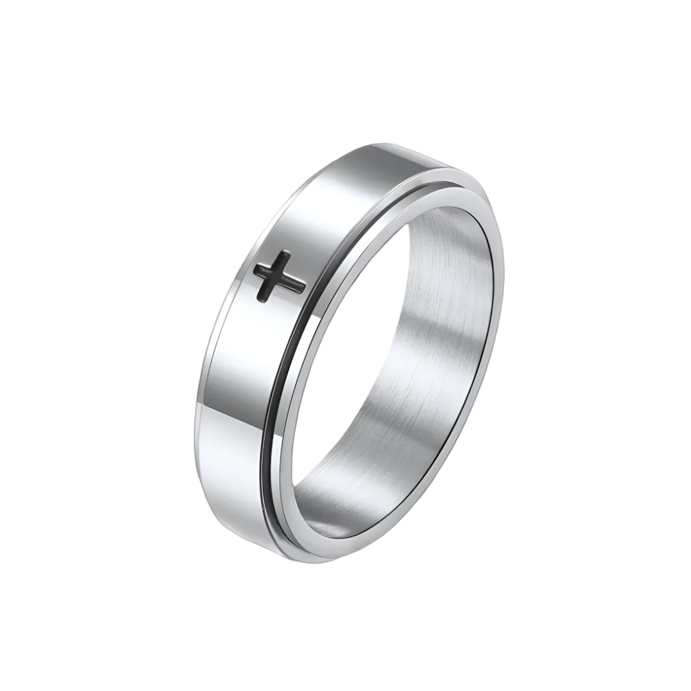 Silver ring with a cross on a white background