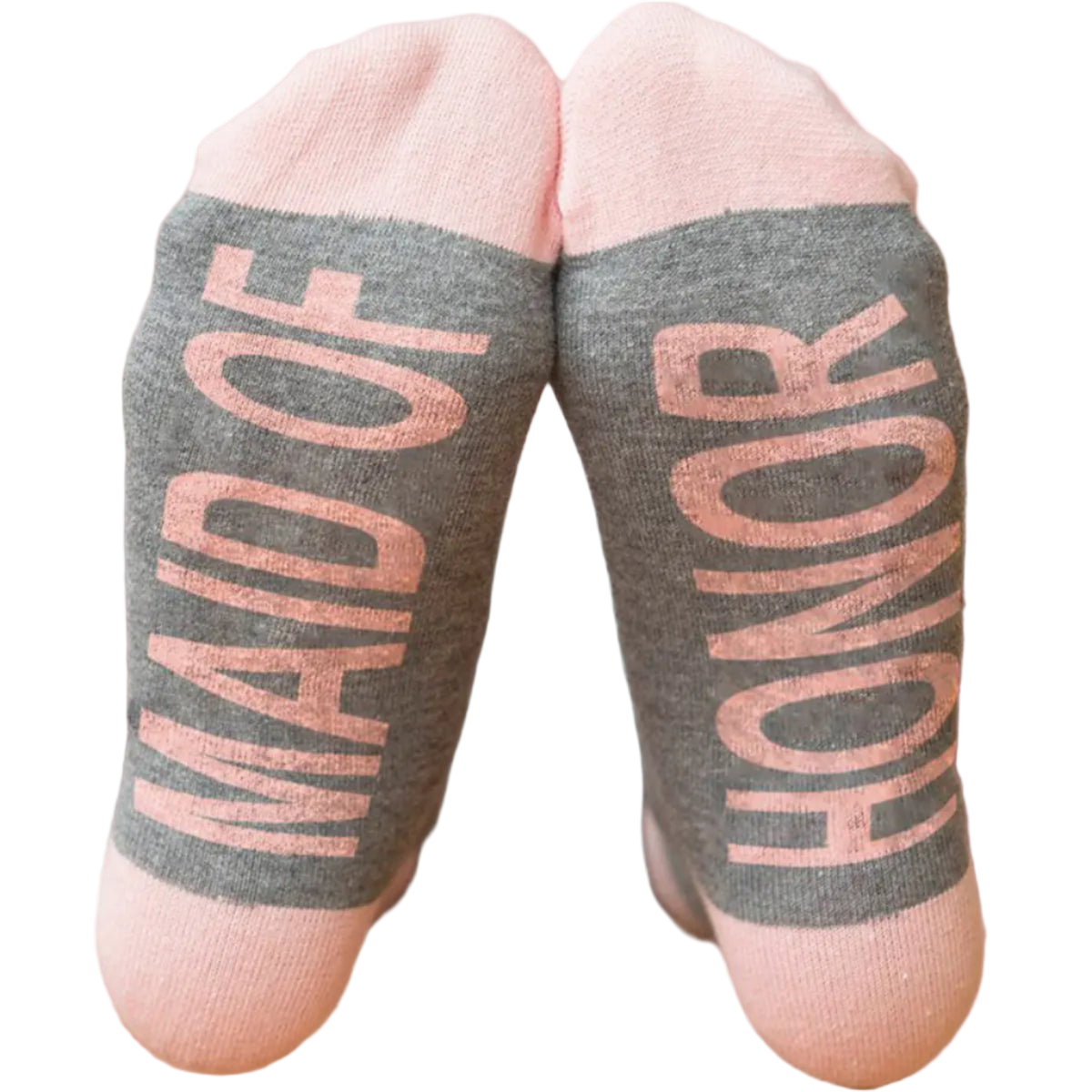 Gray socks with 'Maid of Honor' text worn by a person, blurred background
