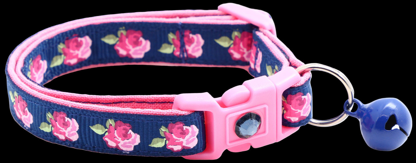 Cat collar with pink floral pattern on a blue background