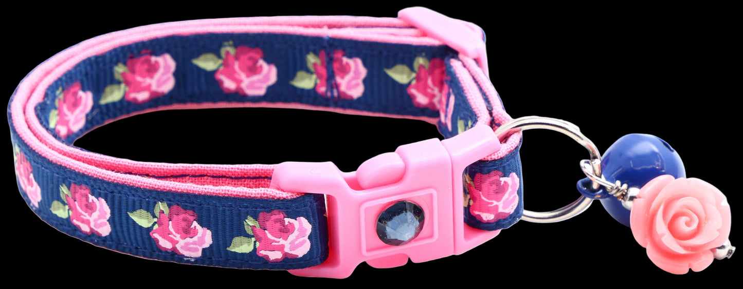 Floral patterned pet collar with pink accents on a white background