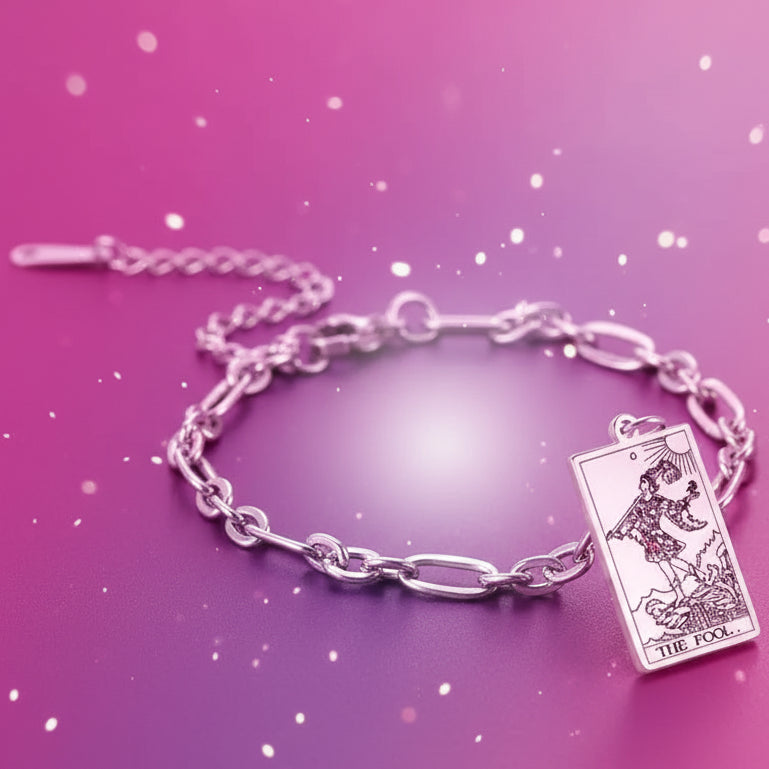 Silver bracelet with a tarot card charm on a white background