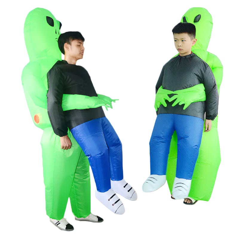 Two people wearing inflatable green alien costumes against a light blue background.