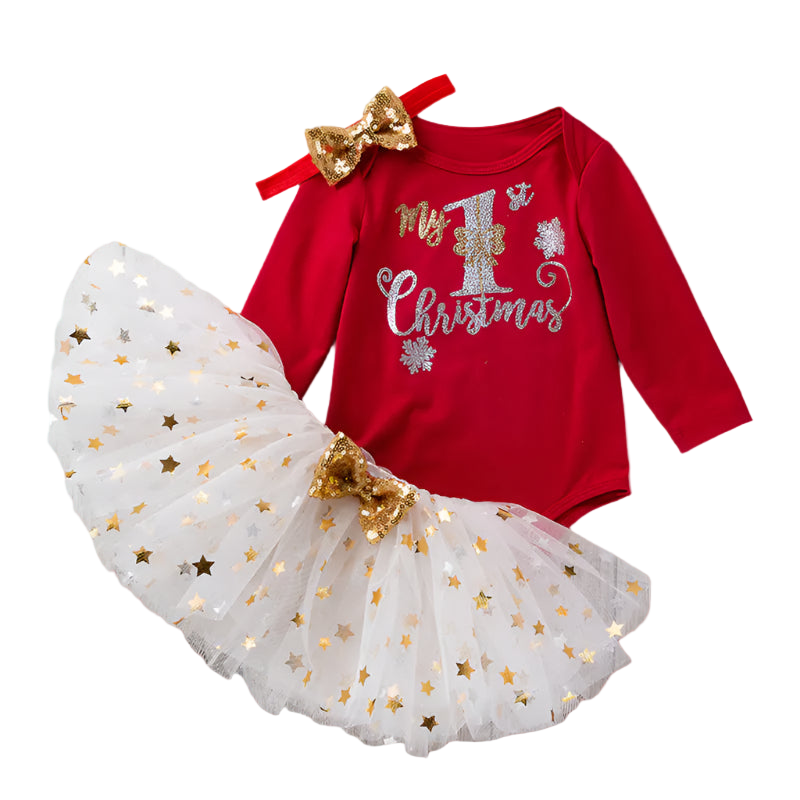 Red baby onesie with 'My 1st Christmas' text and white tutu with gold stars on a wooden surface.