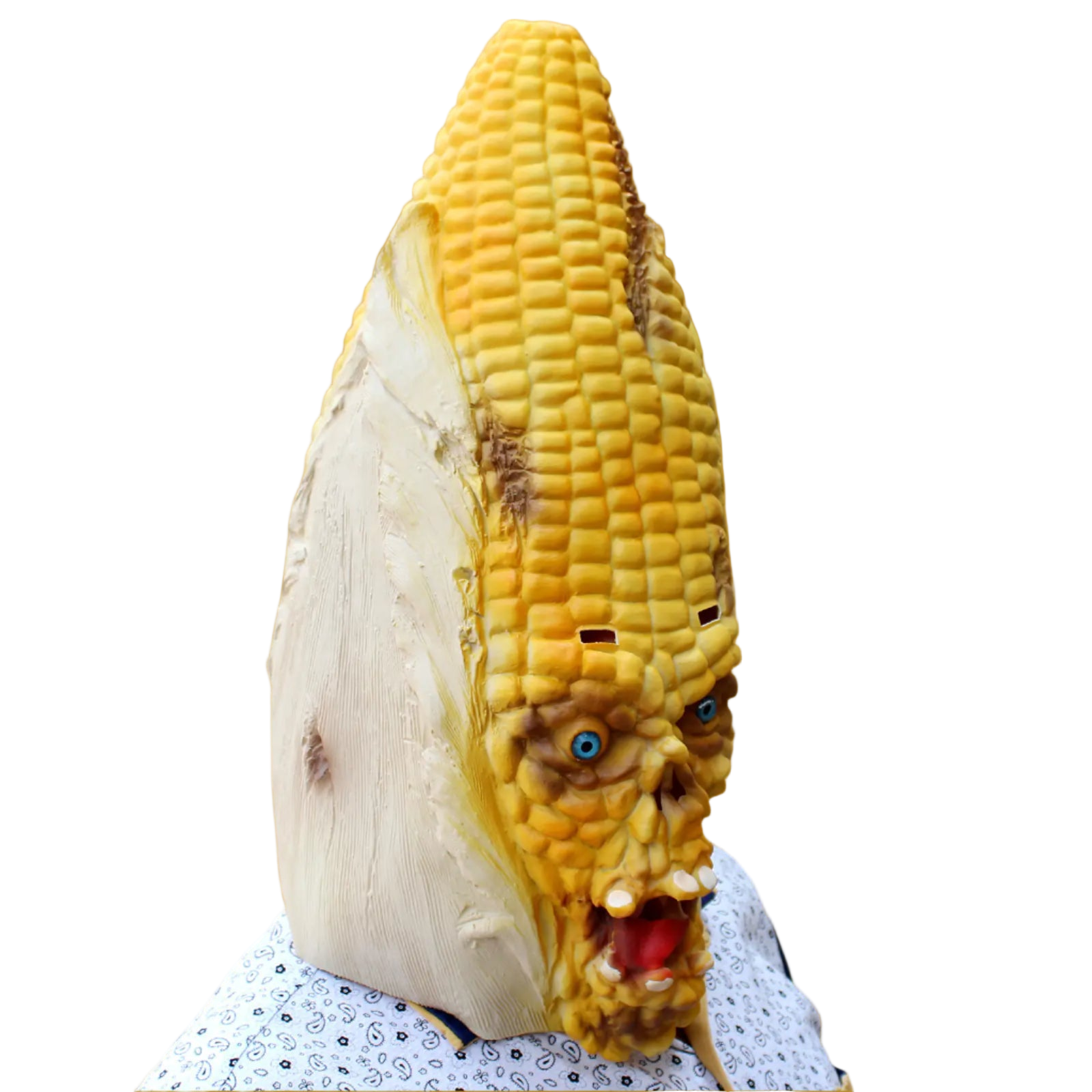 Corn on the cob with a face carved into it against a white background