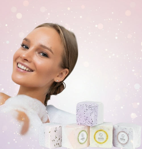 Woman relaxing in a bubble bath with bath bombs on a white background