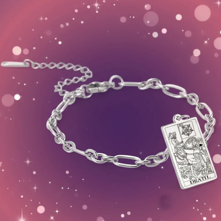 Silver bracelet with tarot card charm on a white background