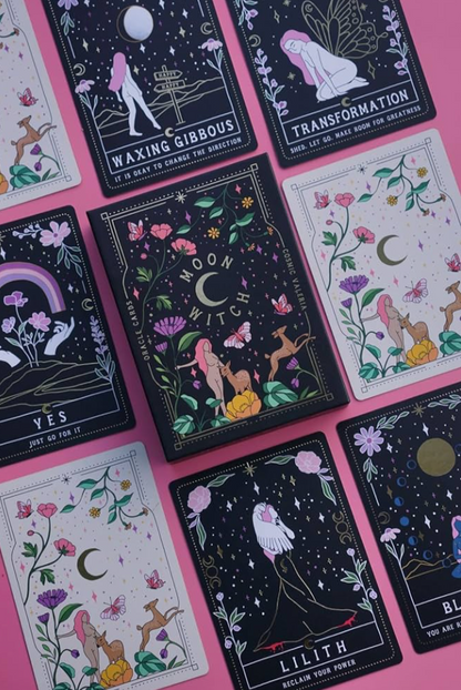Collection of tarot cards with celestial and nature-themed designs on a pink background.