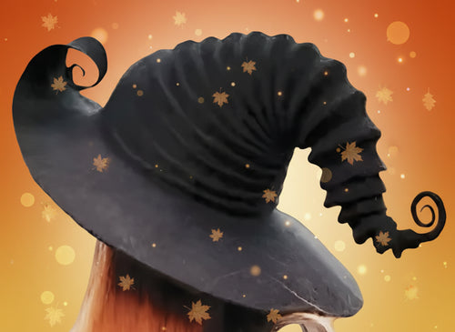 Black witch hat with a pointed top and curved brim, worn by a person with long hair.