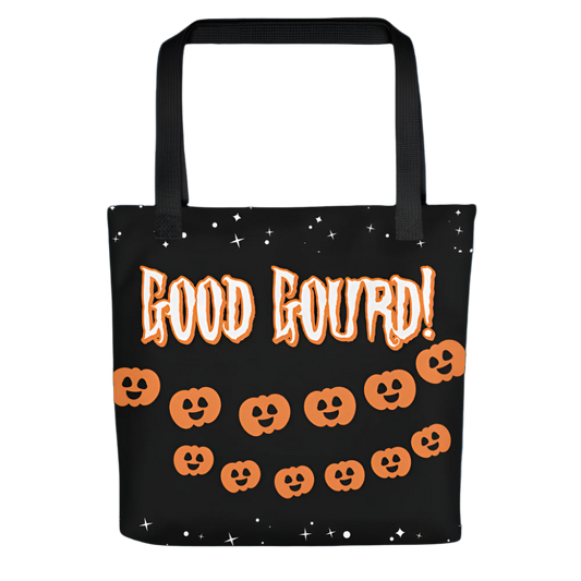Black tote bag with orange text and pumpkin designs on a white background