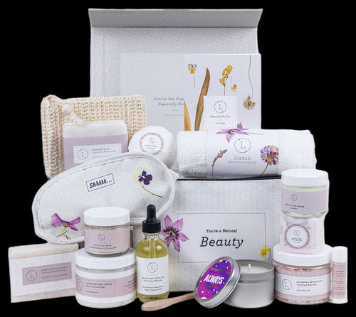 Collection of beauty products including jars, bottles, and a box on a white background