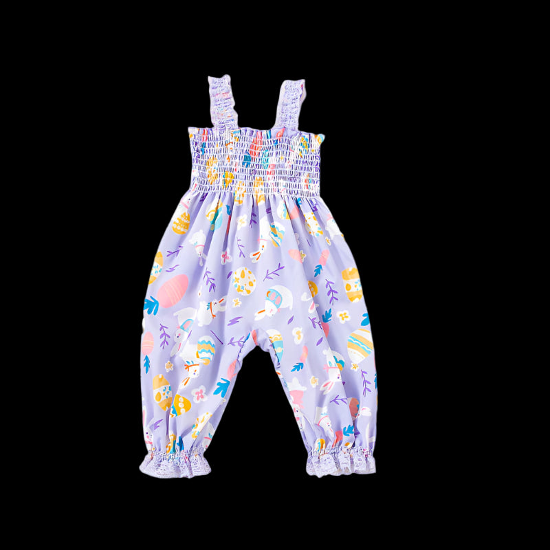 Children's floral romper with matching headband on a beige background