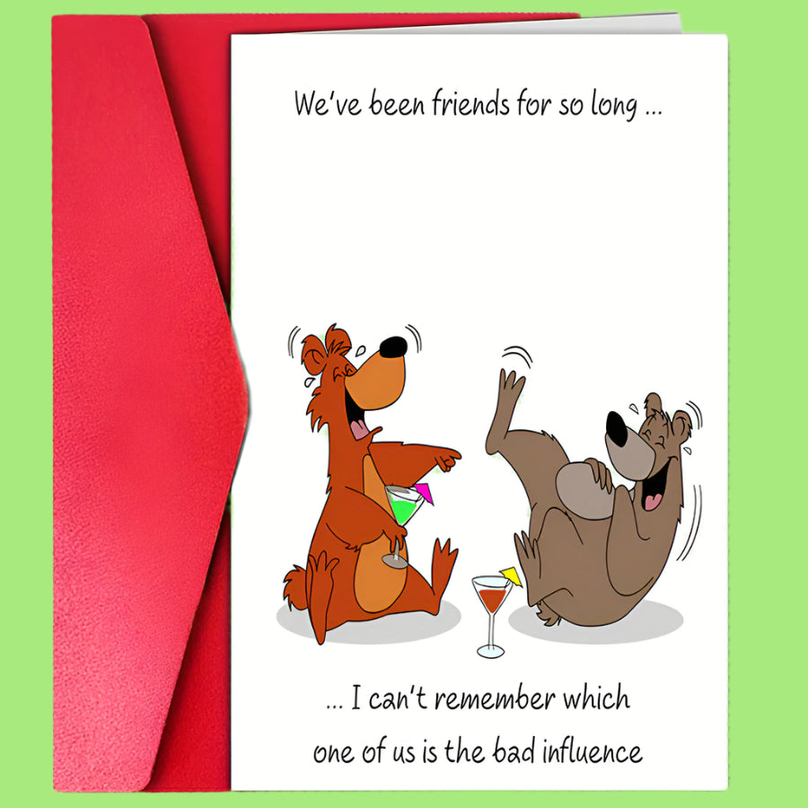 Card with cartoon dogs and humorous text about friendship and influence, with a red envelope.