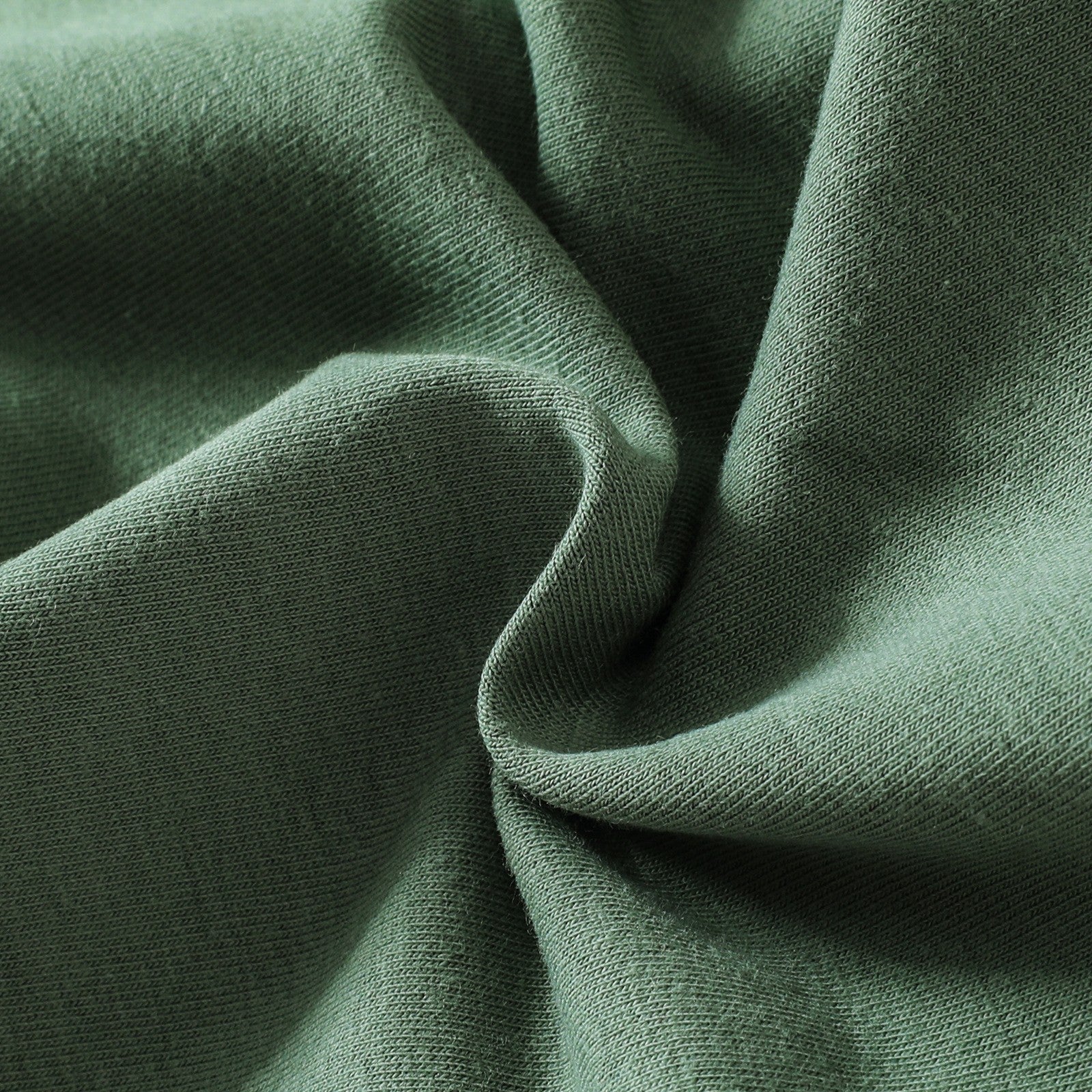 Close-up of green fabric with a textured pattern