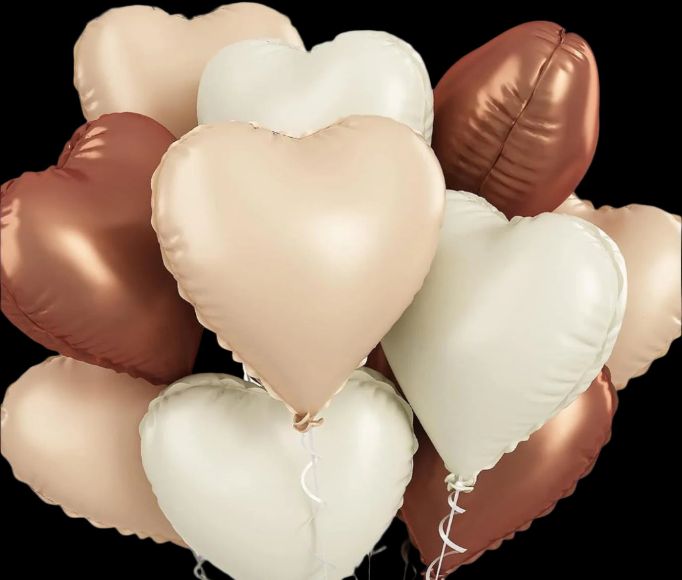 Heart-shaped balloons in rose gold, pink, and white on a white background