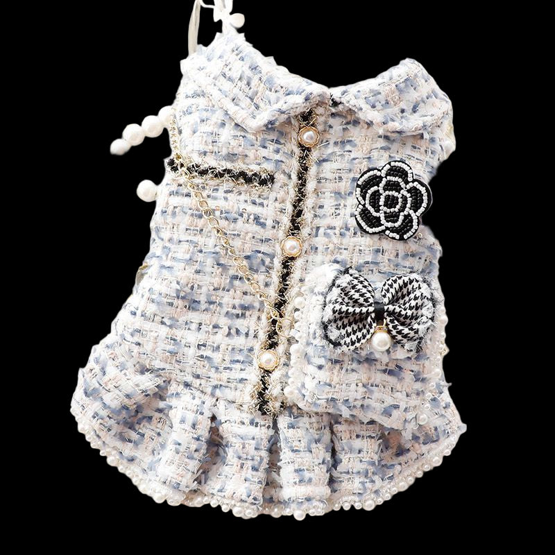Pet coat with decorative elements on a white surface