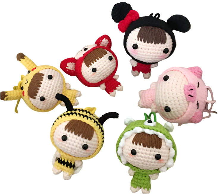 Set of colorful crochet dolls in various costumes on a textured surface