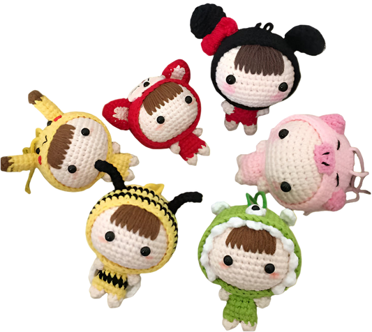 Set of colorful crochet dolls in various costumes on a textured surface