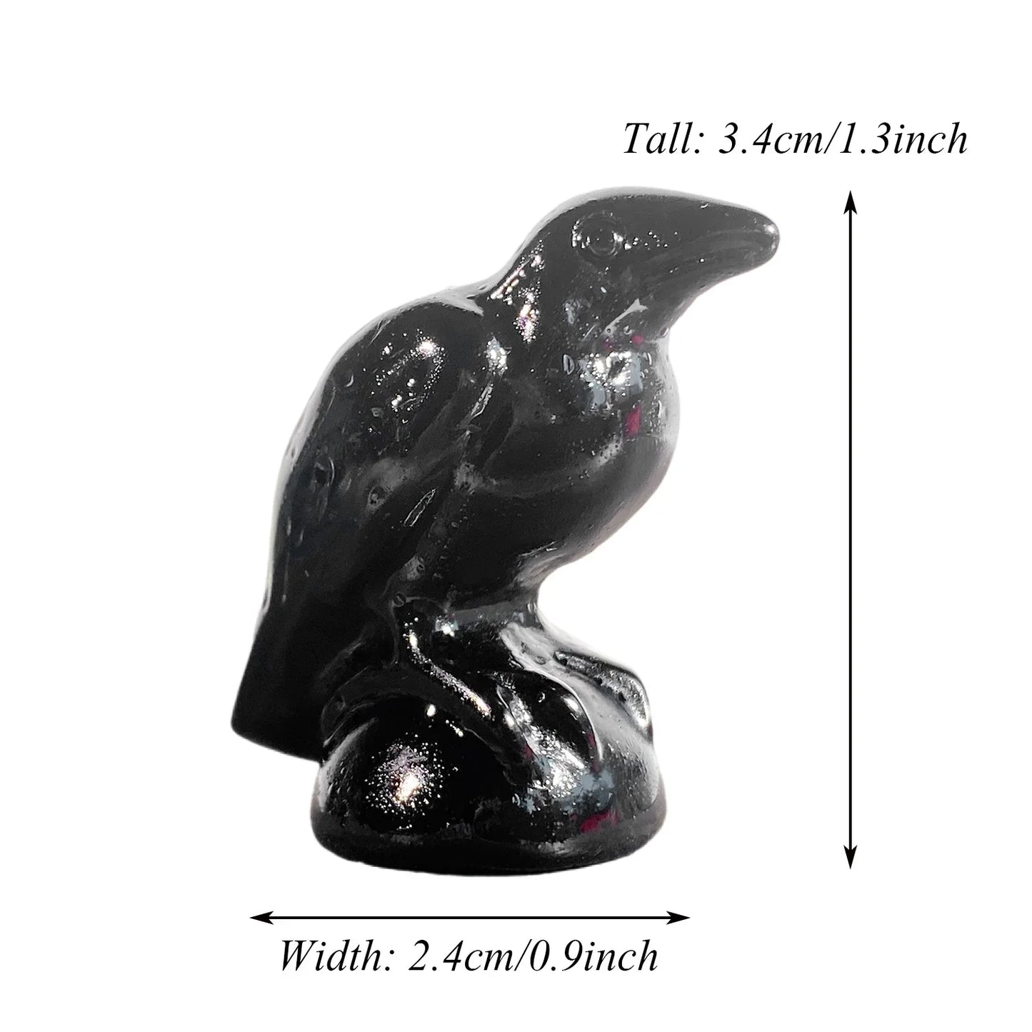 Black bird figurine with measurements on a white background