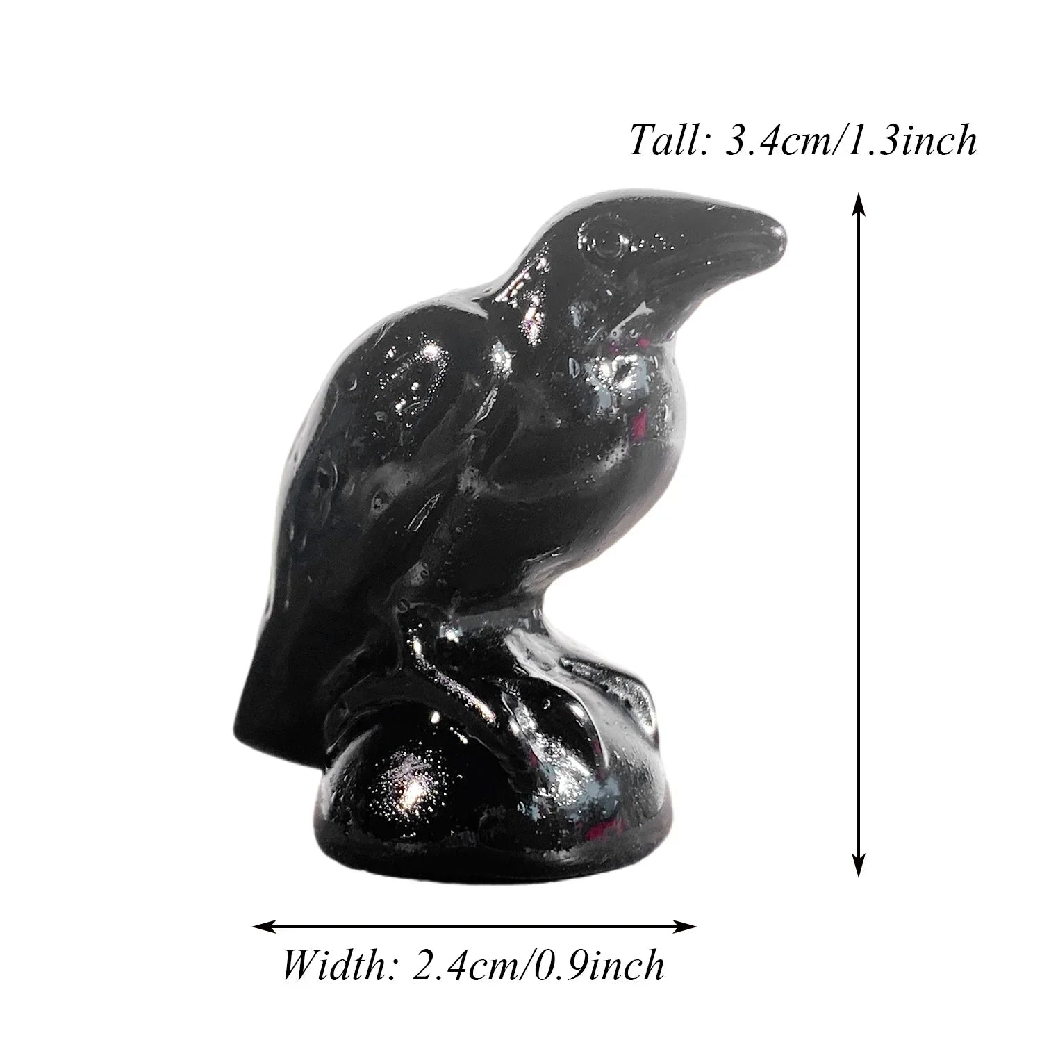 Black bird figurine with measurements on a white background
